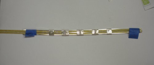 Judy Larson's Two-tone Beaded Bangle - , Classic Wire Jewelry, Wire Wrapping, Wrapping, Wire Wrapping Jewelry, Repeat Step 5 and Step 6 on the two marked lines 1” out from center.  Remove the painters tape as needed. 